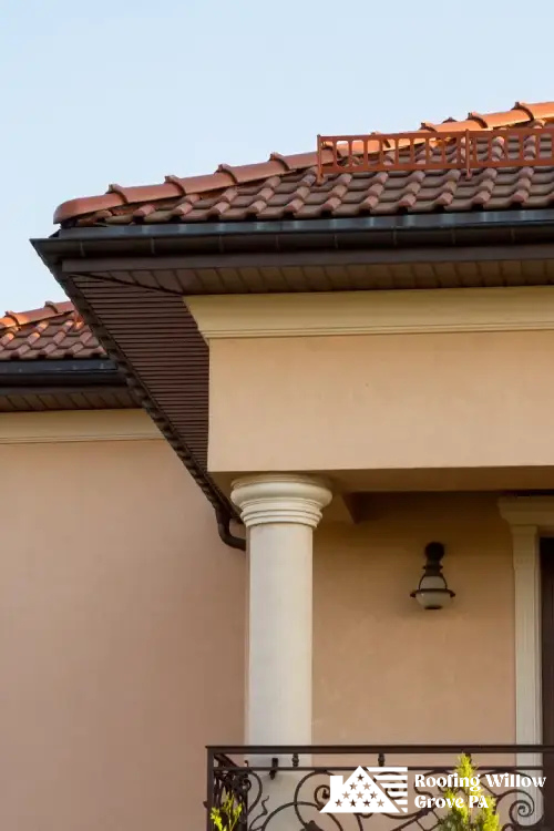 Elegant home with red tile roofing installed by skilled roofing professionals.